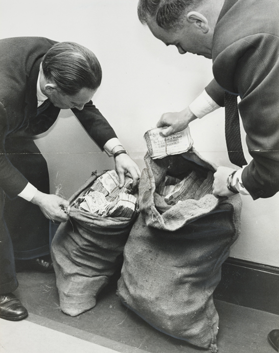 Two sacks of stolen money recovered from the Great Train Robbery, 11 August 1963, Ron Burton Daily Herald Archive, National Media Museum