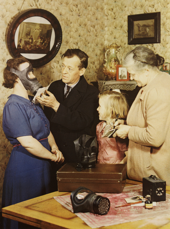 A member of the warden's service fitting a gas mask, 1944, John Hinde, The Royal Photographic Society Collection © National Media Museum, Bradford / SSPL. Creative Commons BY-NC-SA