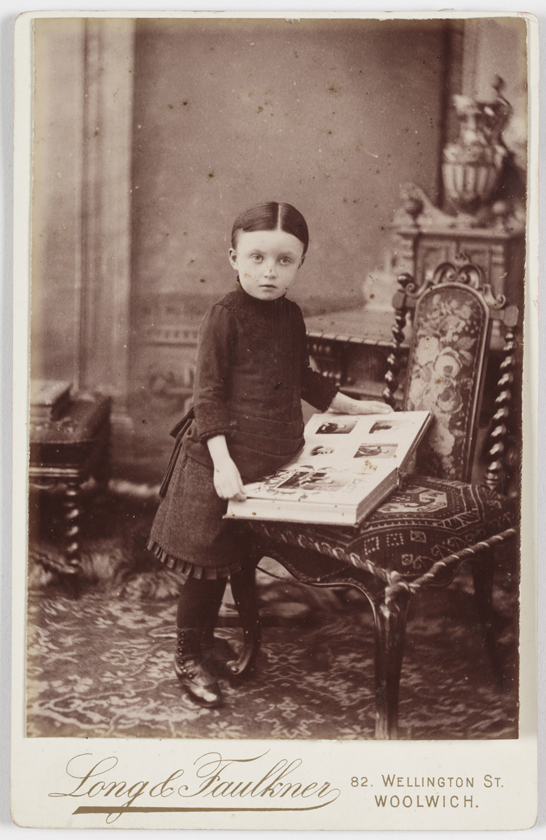 Young girl looking at a photograph album, c. 1890, Long & Faulkner © National Media Museum / SSPL. Creative Commons BY-NC-SA