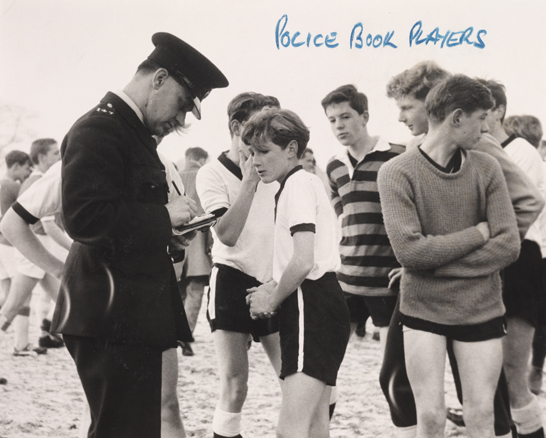Police book Sunday football teams, 1962, Clements © Daily Herald / National Media Museum, Bradford / SSPL Dore Juniors and Sheffield Rovers had held a 'disorganised' football game in the hope of beating the Corporation bylaw forbidding organised sport on Sundays. 