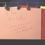 Handwritten card reading "I love this gallery! I would like to be part of a special exhibition, as a photographer"