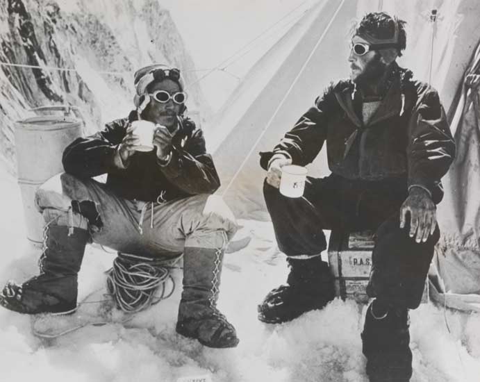 Tenzing Norgay and Edmund Hillary drink a celebratory cup of tea