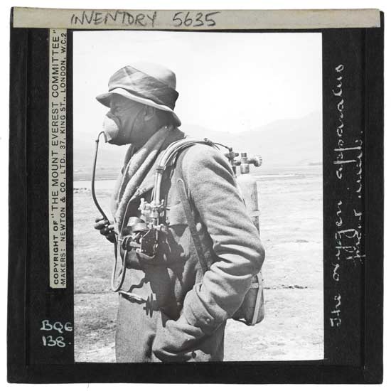 George Finch wearing primitive oxygen apparatus.