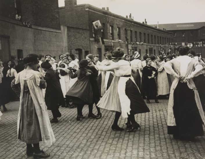 Picture of a street party in London celebrating the official declaration of peace, 1919