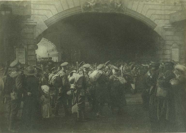 Black and white picture of soldiers waiting at London Victoria train station.