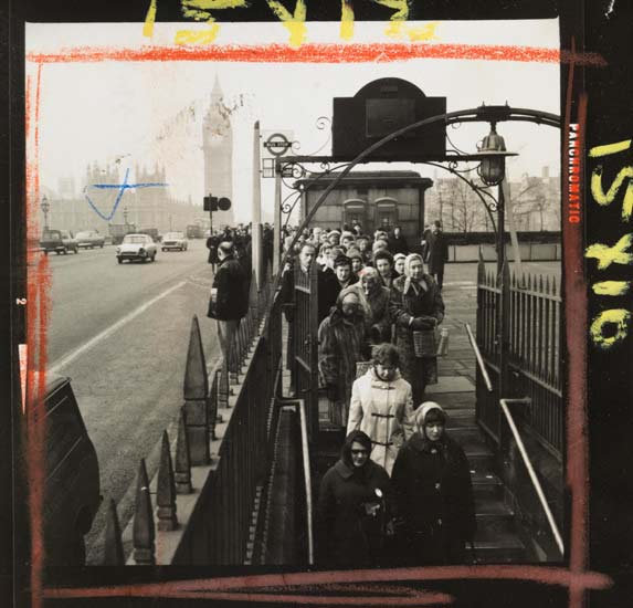 People queuing to enter the subway next to the Palace of Westminster