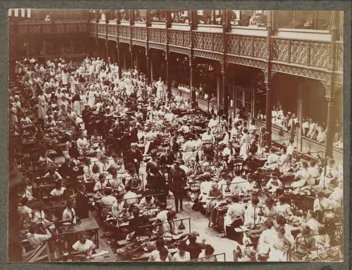 Picture of the King and Queen visiting an army clothing factory in 1916