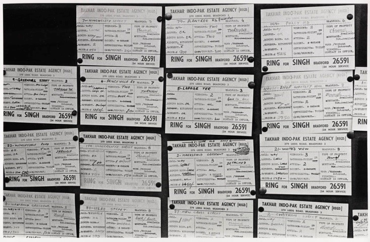 Estate Agent's windows, Bradford by Nick Hedges