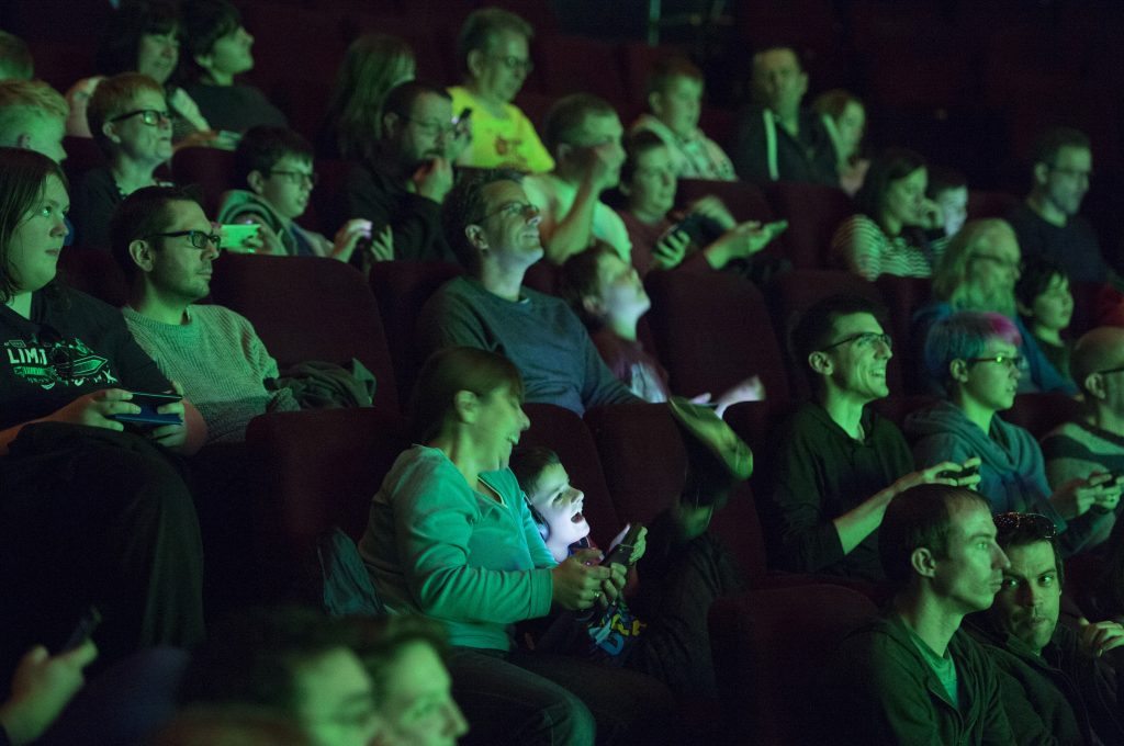 Audience members enjoying WiFi Wars