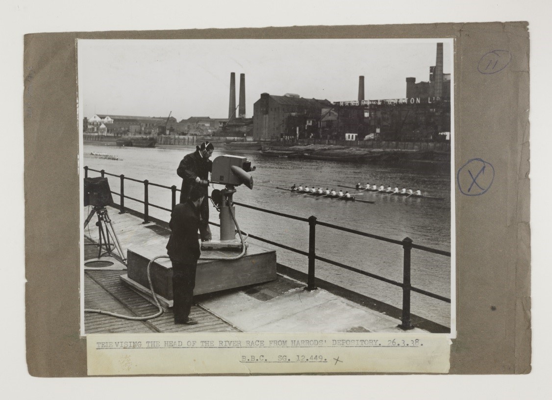 Cameramen filming the head of the river race from Harrods' Depository