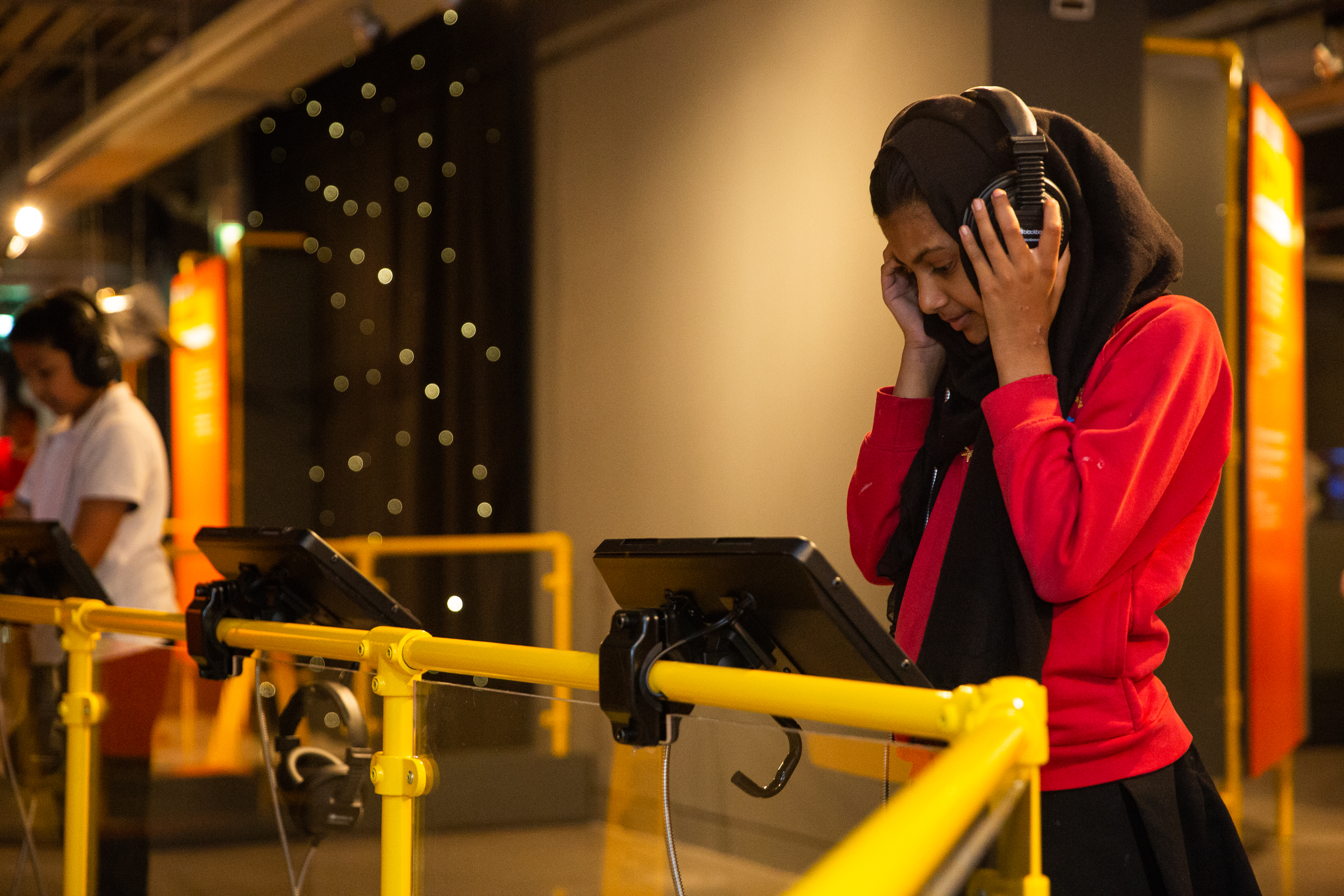 A student tries out an interactive display at the Action Replay exhibition