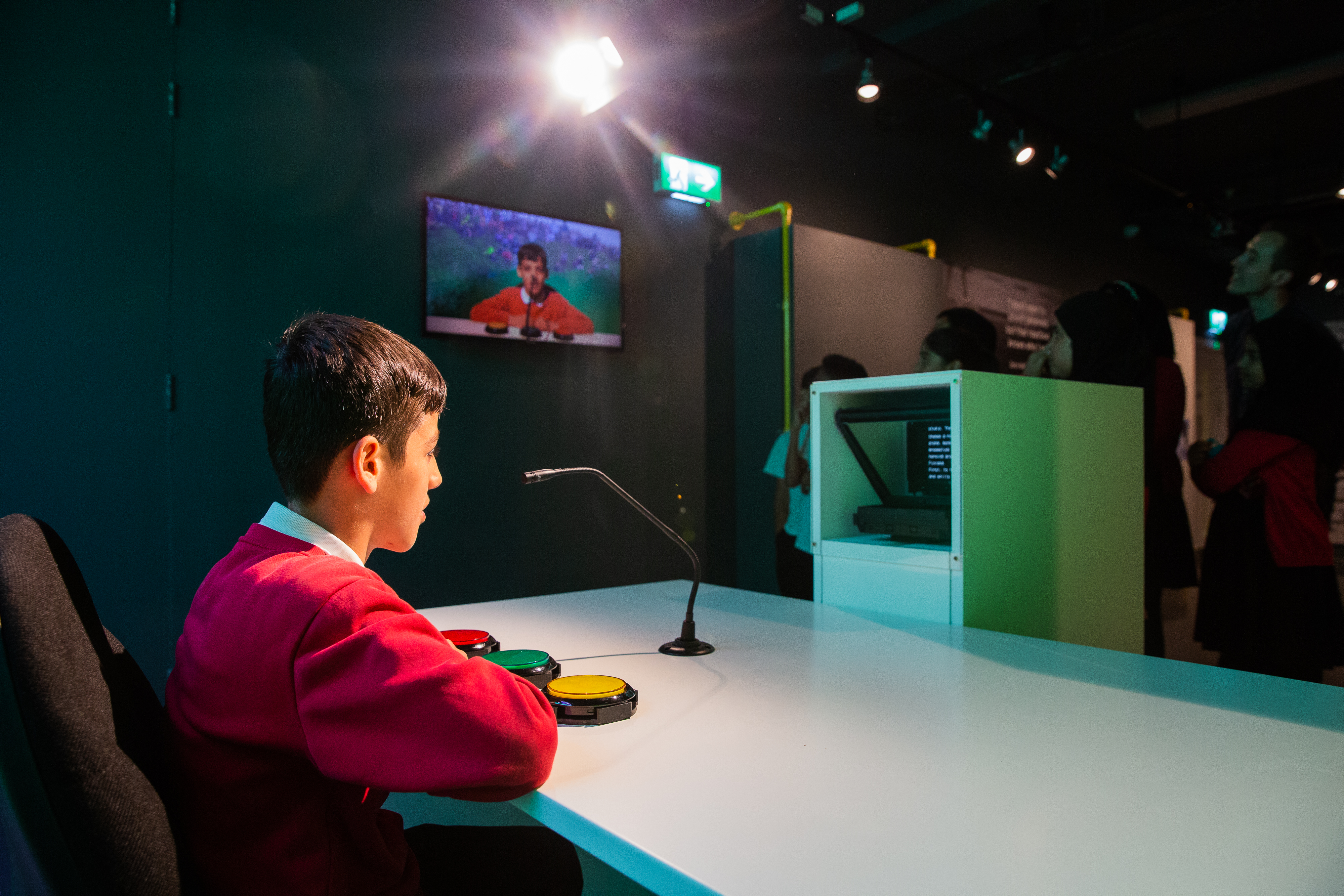 A student tries out 'Be a Presenter' at the Action Replay exhibition