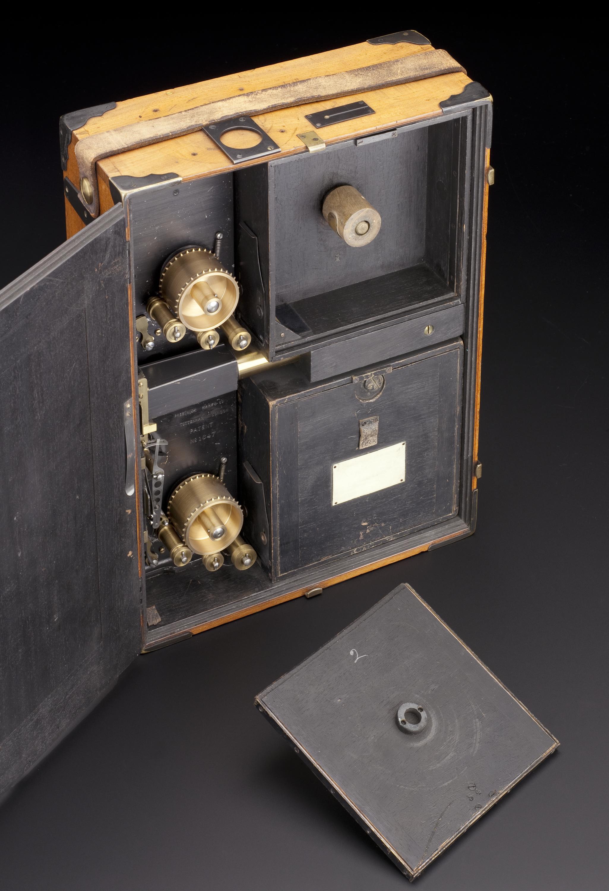 Prestwich cinematographic camera, used by Mr H.G. Ponting in Scott's Antarctic Expedition, 1910. Detail view of object against graduated grey background.