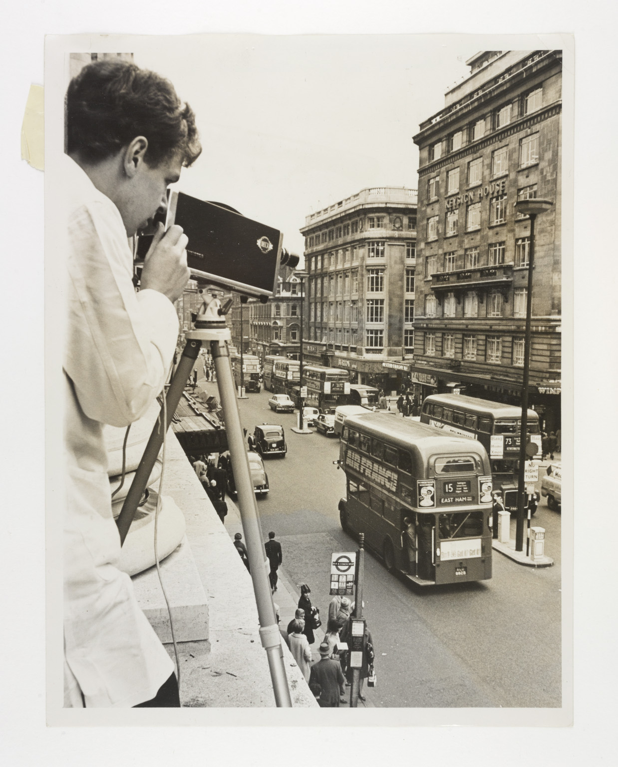 Image of a CCTV camera operator looking down on Oxford Street, London
