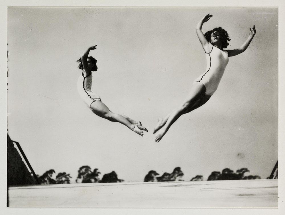 Two gymnasts on a trampoline