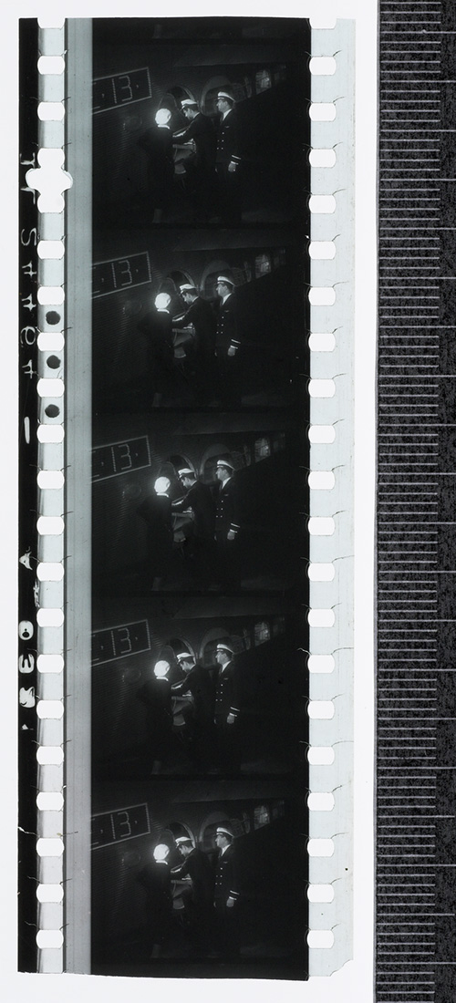 Five frames of 35mm film showing men in naval officers' uniforms