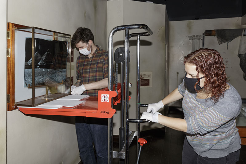 Museum staff removing display