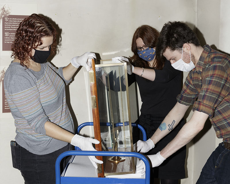 Museum staff removing display