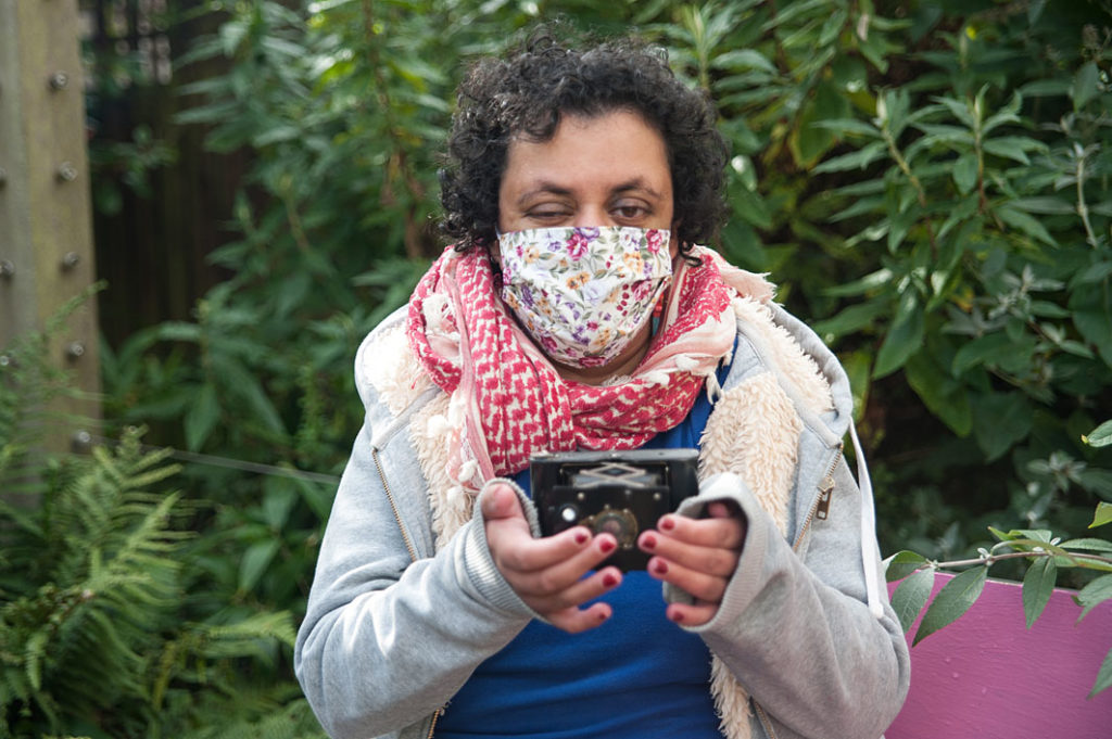 Khadijah holding Kodak camera