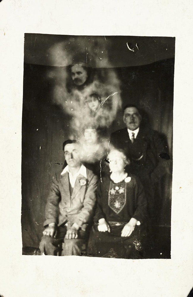 Photograph of a family group with two ‘spirits’ by William Hope