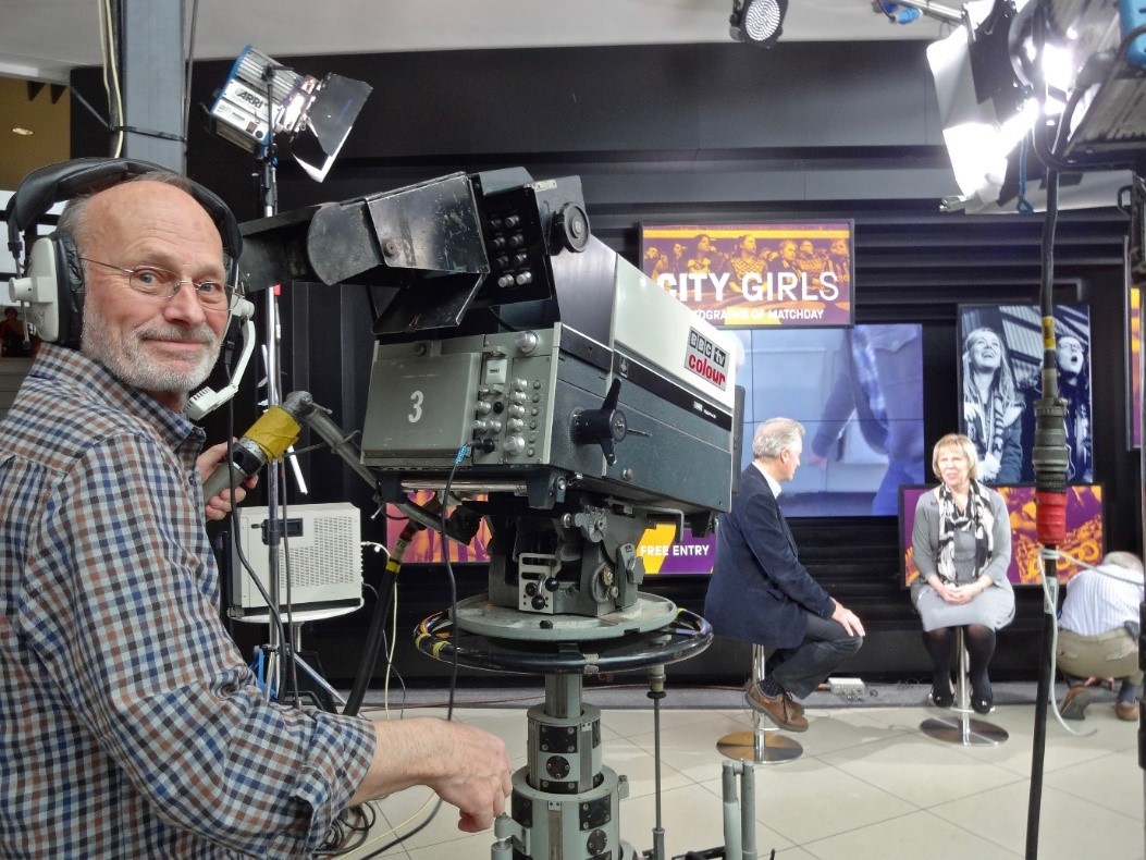Robin conducting a period 1970s recreation in the foyer of the National Science and Media Museum