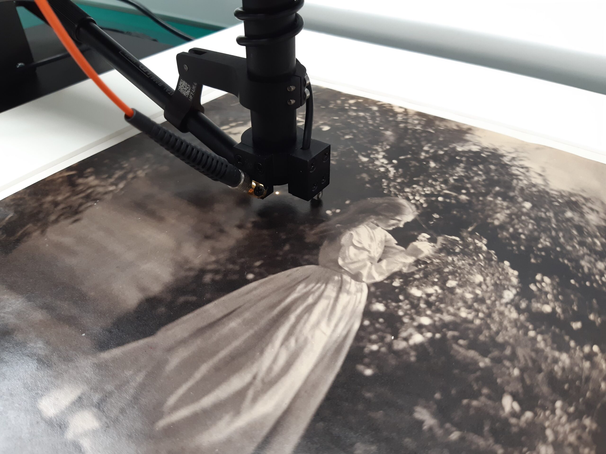 A photograph under the small black microfading tester