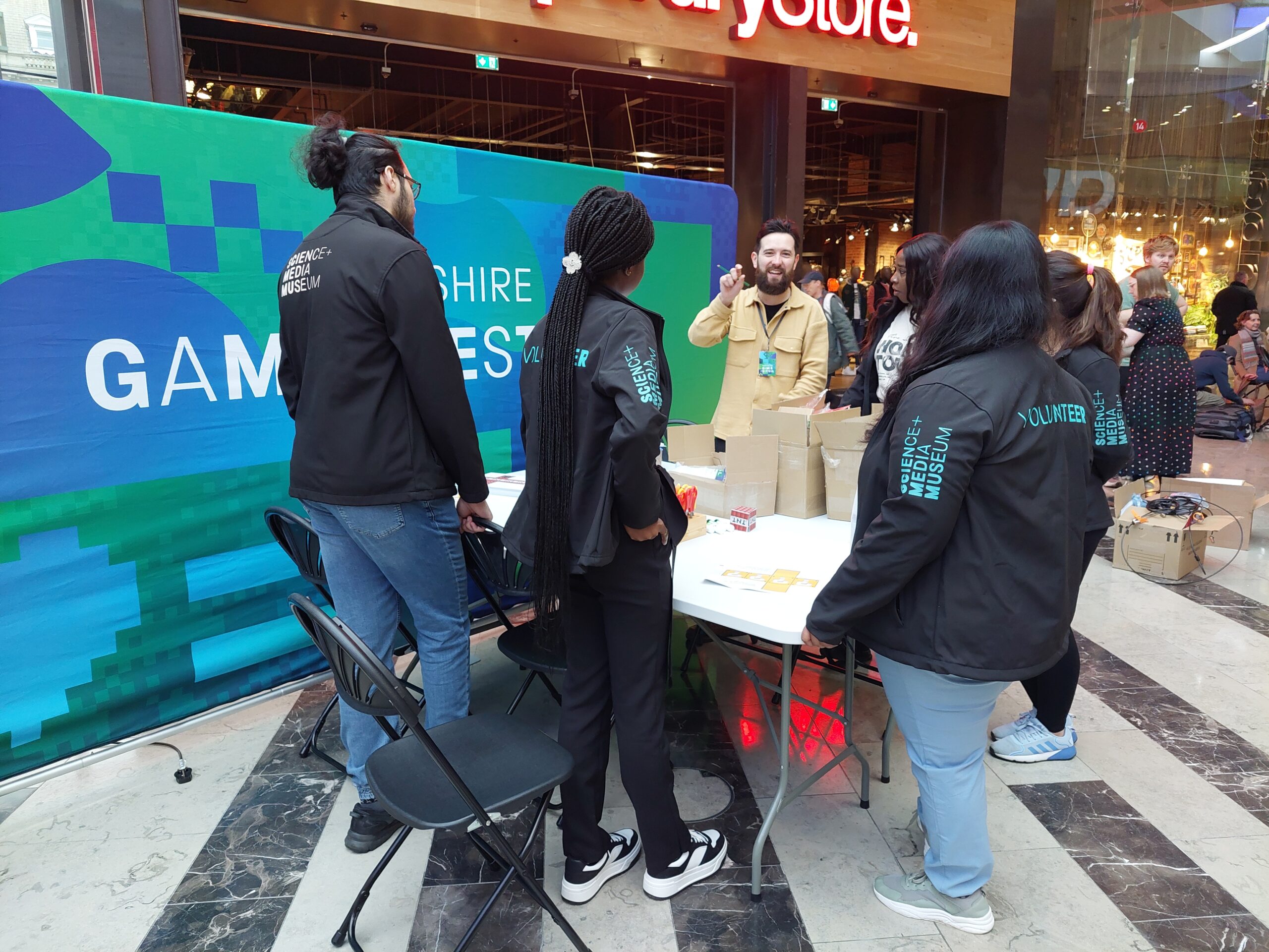 A group of people in Science and Media Museum jackets