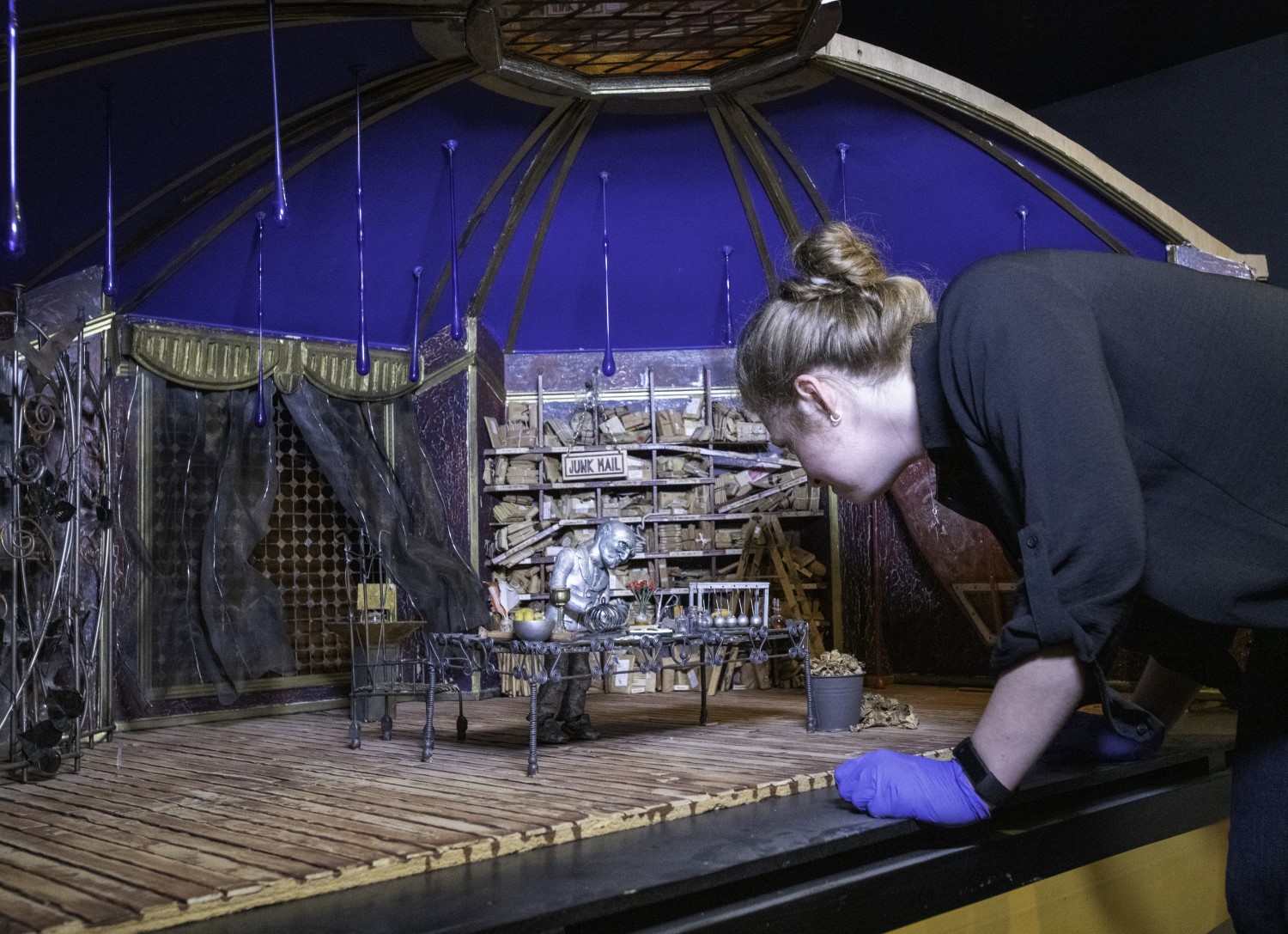 Eleanor leans over a large animation set