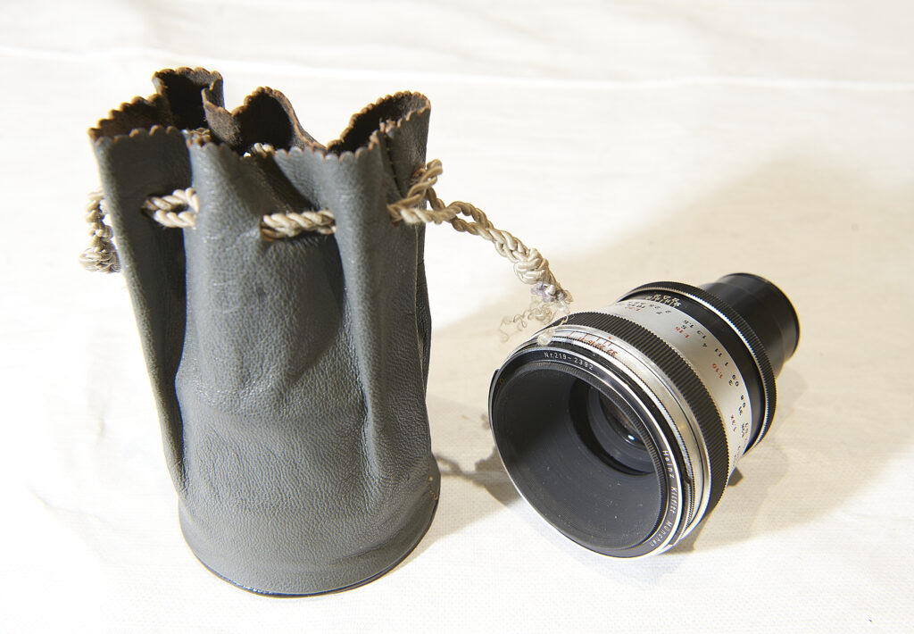 Camera lens and black drawstring pouch