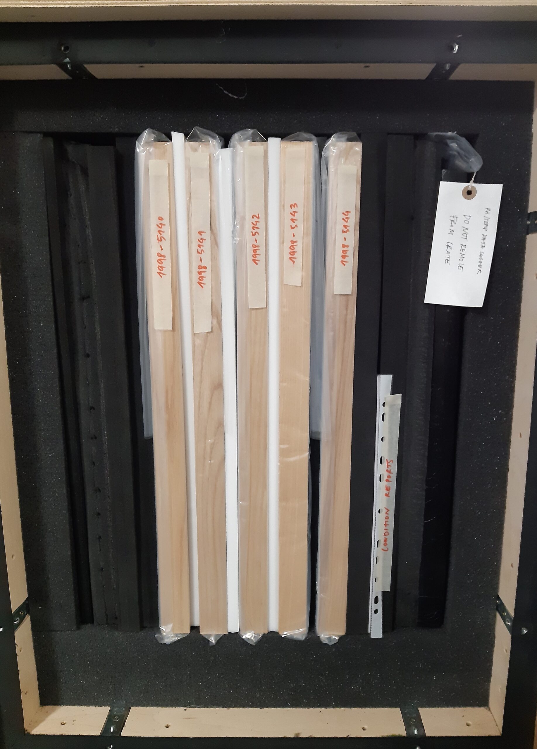 Side view of picture frames inside a box