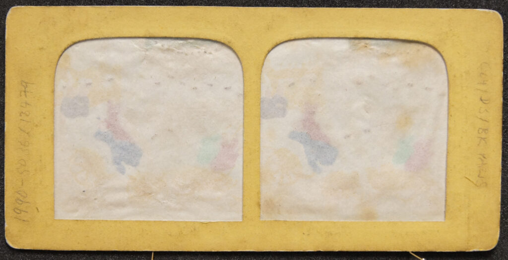 The back of a picture mount with two spaces for the image.