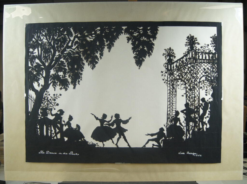 A view of the whole image after treatment, showing dancers in an ornate park