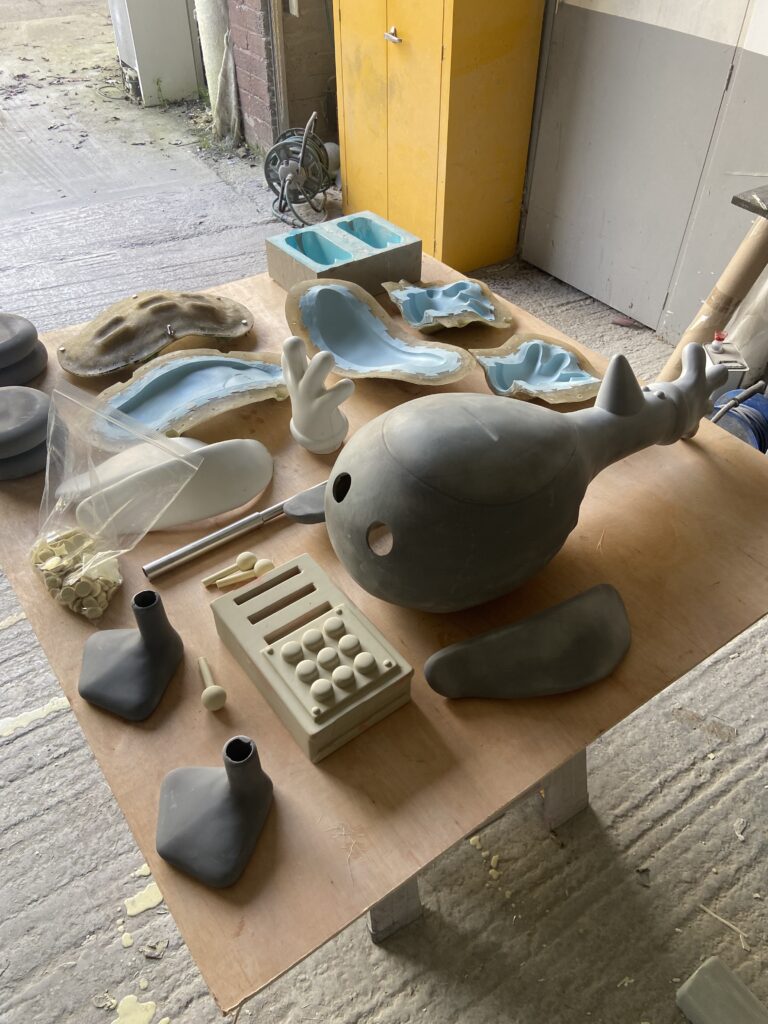 Model of a penguin in pieces on a workbench