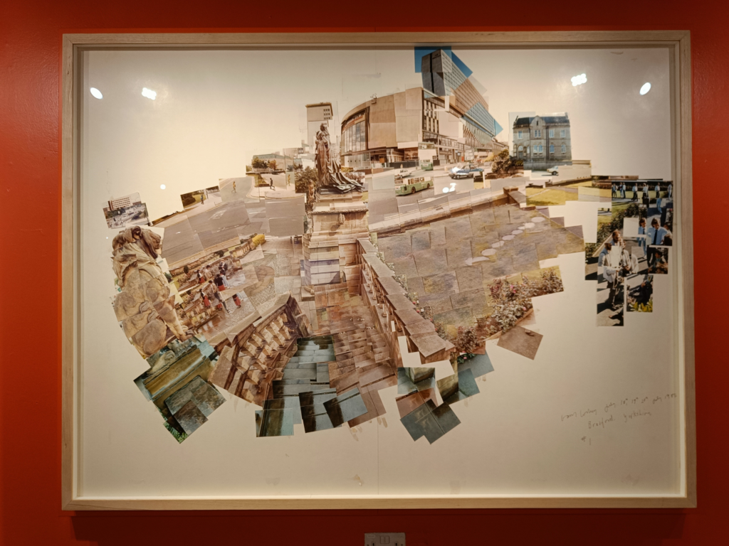 One of Hockney's framed joiners on a red gallery wall