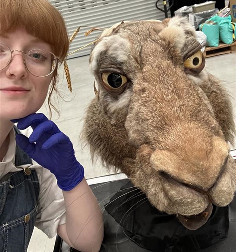 Martha takes a selfie with the March Hare head