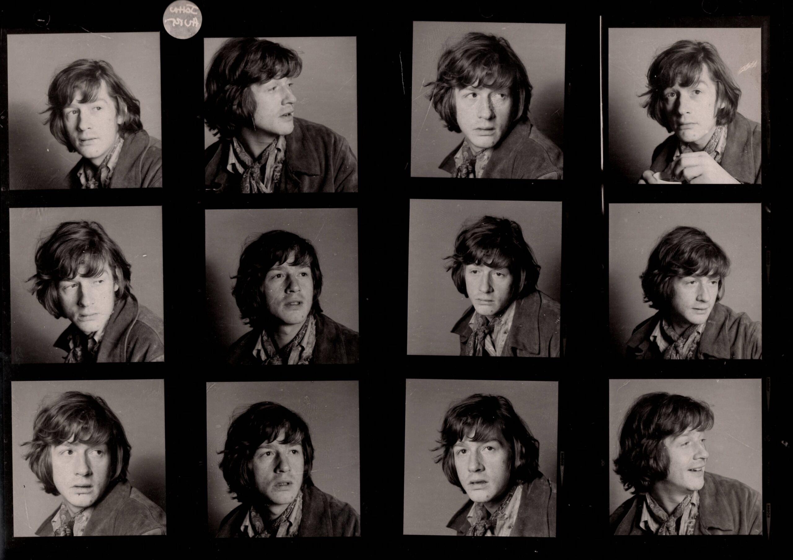 12 small photos of John Hurt, with long hair and wearing a leather jacket and neckerchief