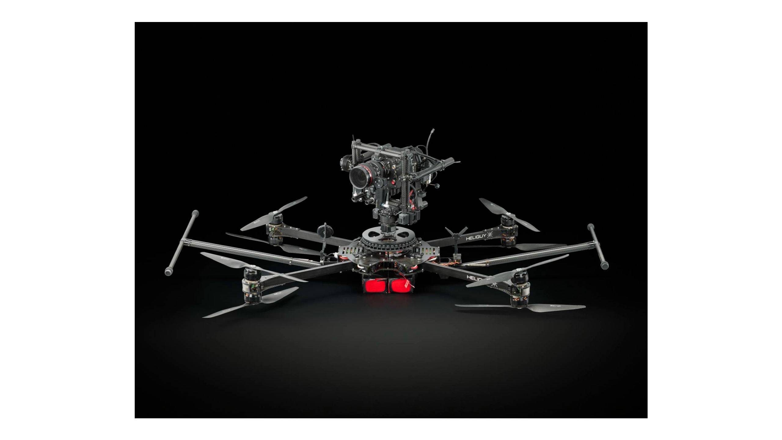 A drone with 8 legs and a large camera mounted on top.