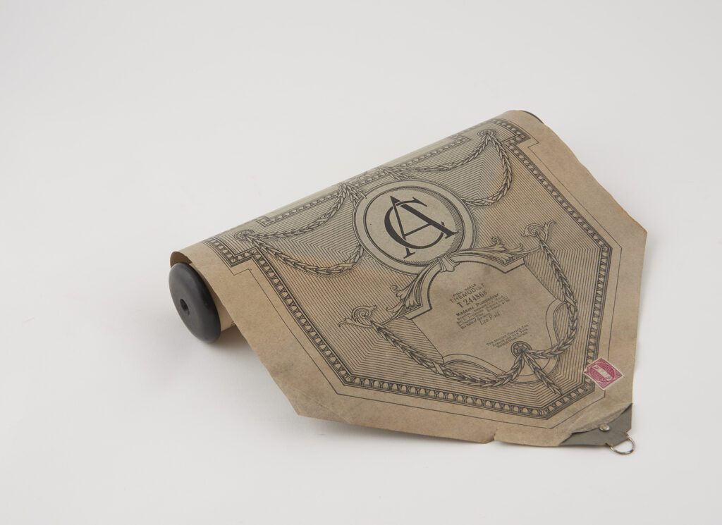 Roll of paper slightly unrolled, the end of the paper is in a triangle point