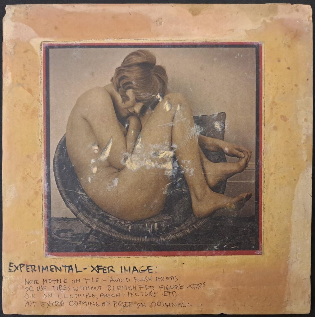 Sepia toned image of Pauline nude in a basket chair