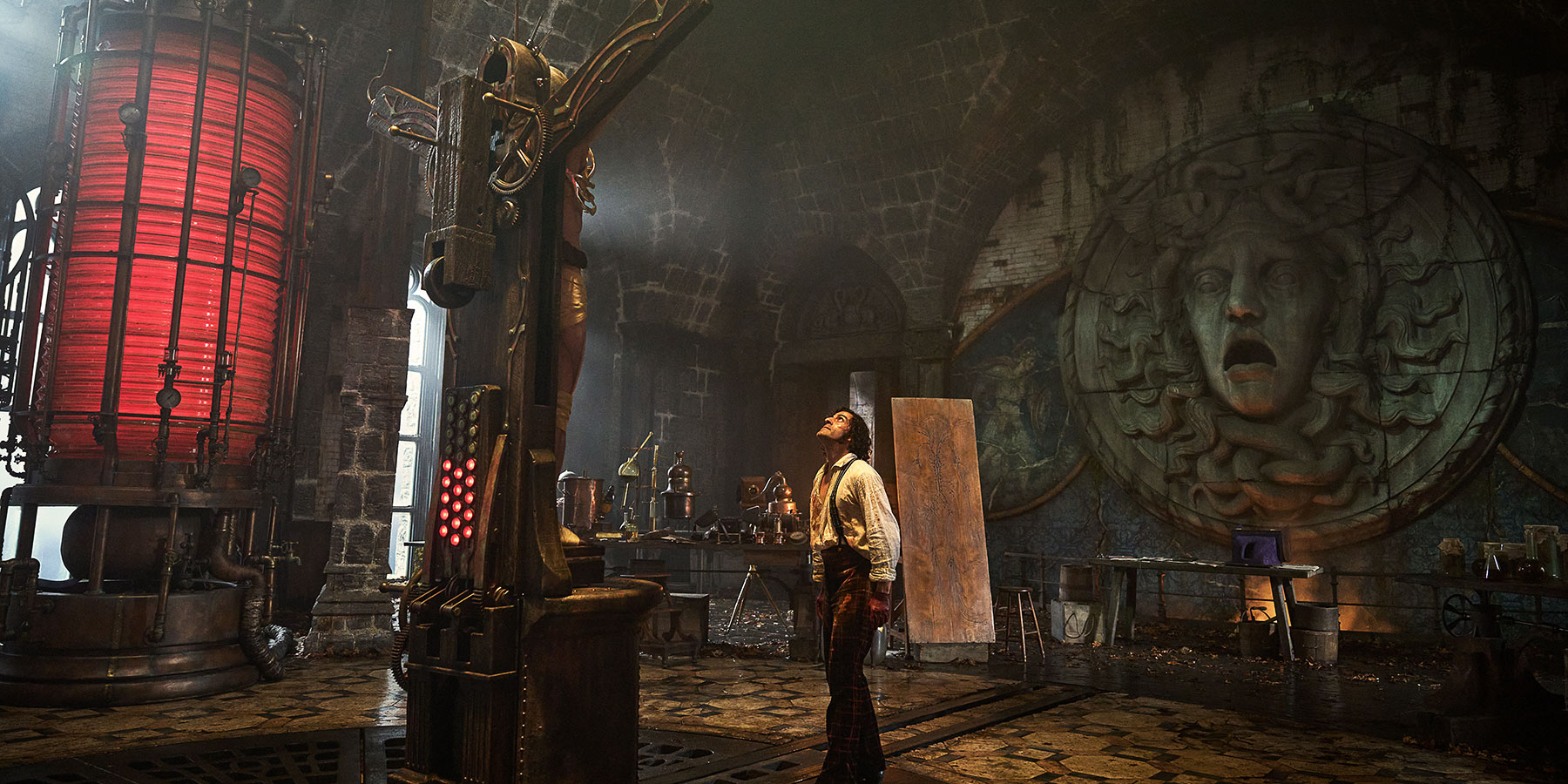 Oscar Isaac in a gothic laboratory as Dr Frankenstein