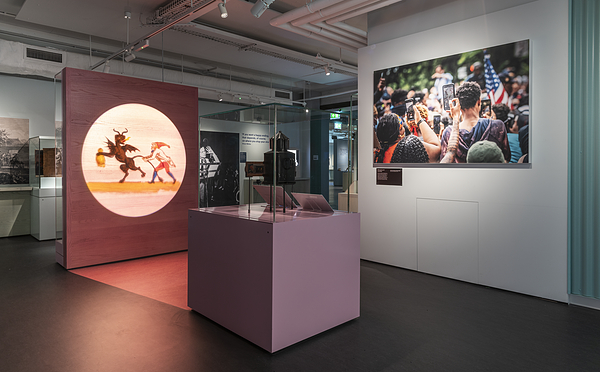 In the Sound and Vision galleries, there is a magic lantern projector inside a glass display case. A circular image is projected on a freestanding wall infront, giving the impression of live projection