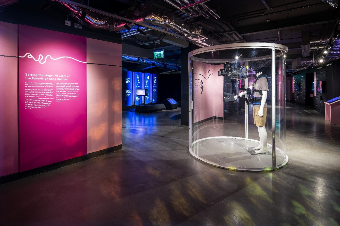 The steadicam on display on a mannequin in a curved glass display case in the Eurovision exhibition