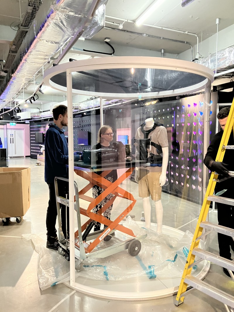 Emma and Ben use a small scissor lift to manoeuvre the Steadicam into the open display case
